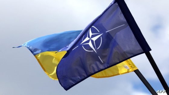 The NATO and Ukrainian flag are pictured in Vilnius, Lithuania on July 9, 2023, a few days ahead of a July 11-12 NATO Summit. (Photo by PETRAS MALUKAS / AFP)